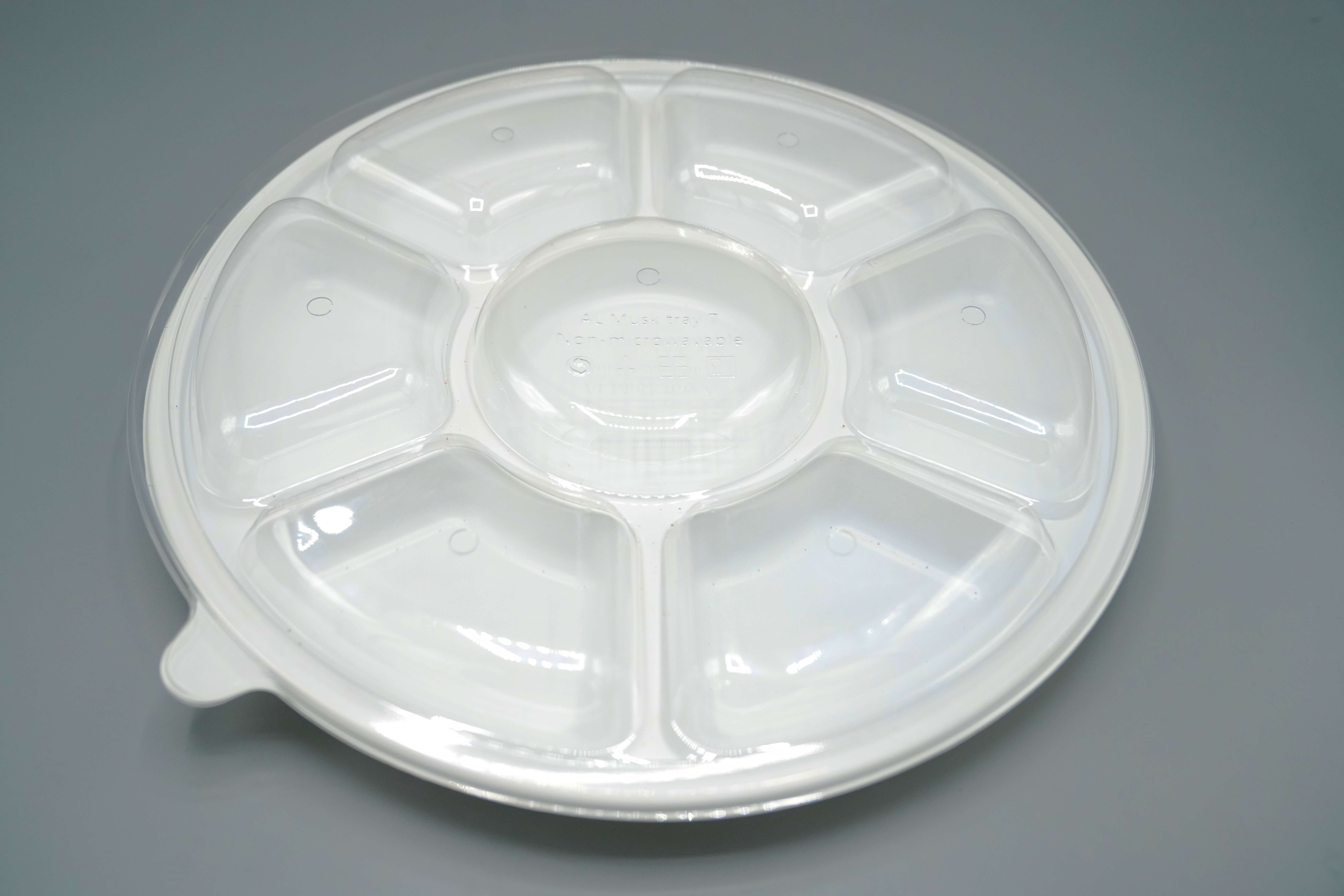 Plastic appetizer plate with 7 compartments, 34 cm, white color, with a separate transparent lid. Microwave safe, good quality, reusable, 100 pieces per pack.